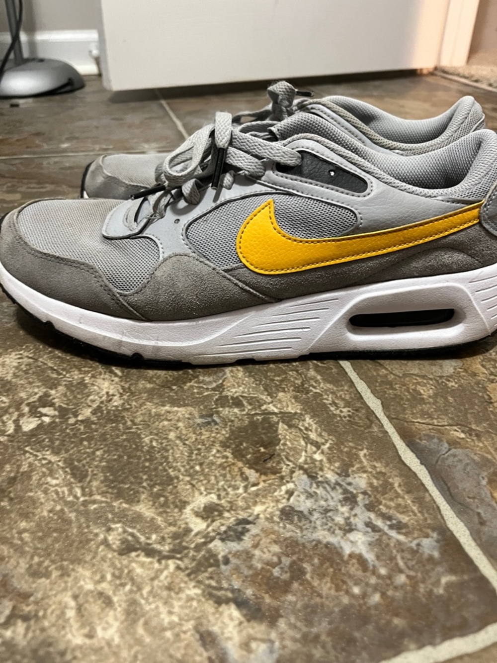 Nike Gray Sneakers with Yellow Swoosh